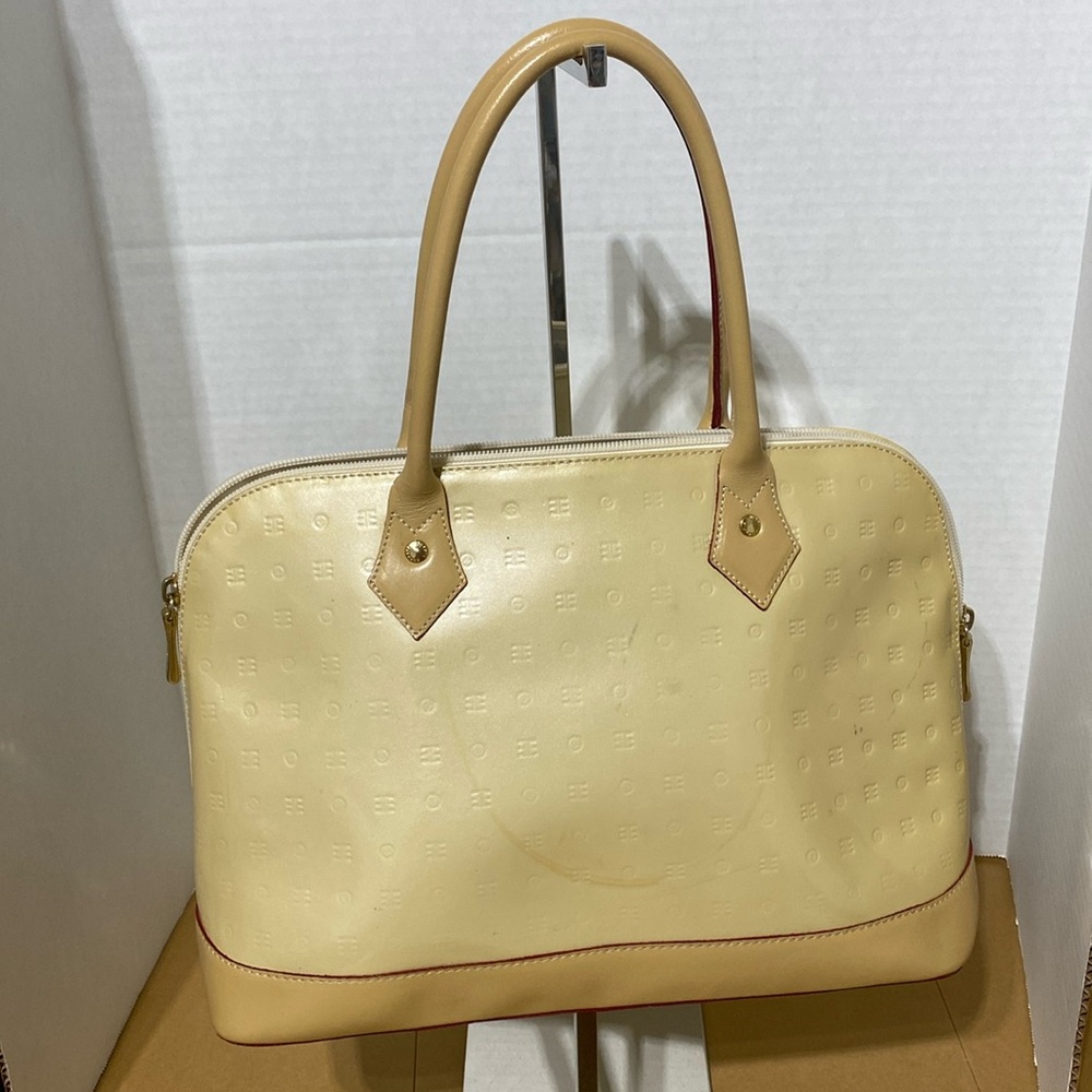 GUC. Arcadia buttercup, patent leather Bugatti bag. Made in Italy.